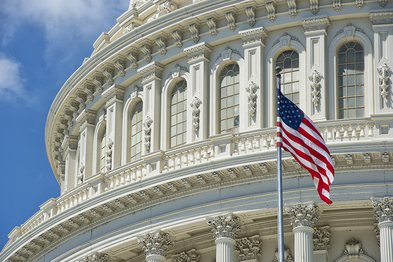 A flag flies outside of the U.S. Capitol